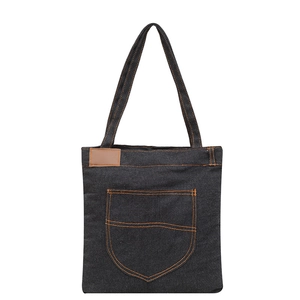 Large denim tote bag with contrast orange stitching and spacious front pocket