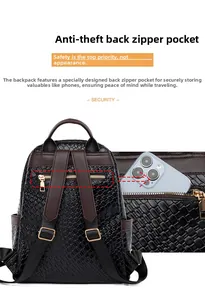 Macro detail of secure rear anti-theft zipper pocket on woven black leather backpack