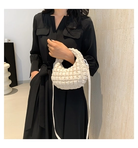 Quilted cloud tote bag in off-white featuring soft pleated texture and shoulder strap