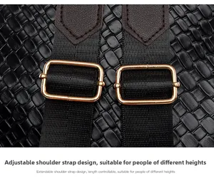 Detail of adjustable nylon shoulder strap with gold-tone hardware on black woven backpack