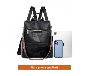 Detail showing the large capacity of a black PU leather backpack fitting a phone and iPad