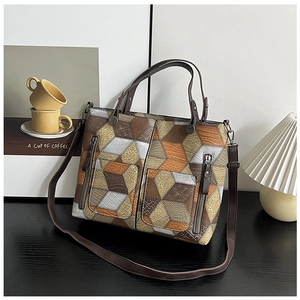 Detail of vintage geometric patchwork tote bag with crocodile and grained texture