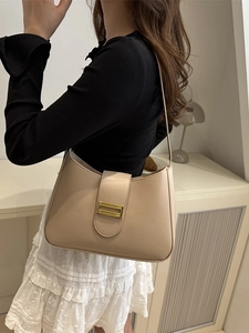 Chic apricot baguette shoulder bag with gold metal buckle for a minimalist summer look