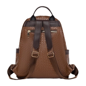 Brown woven leather backpack for women with anti-theft back pocket and adjustable straps