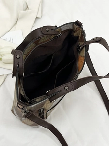 Retro multi-color patchwork leather tote bag with spacious interior and adjustable strap