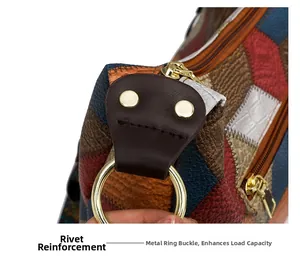 Detail of metal rivets and gold hardware on multi-color patchwork leather tote bag