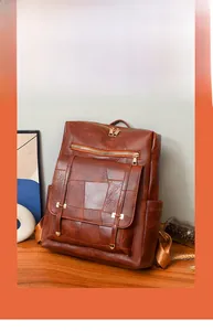 Detailed close-up of brown PU leather backpack with patchwork design and gold zippers