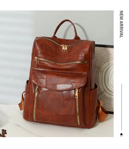 Détails du sac à dos vintage marron en similicuir avec fermetures éclair métalliques