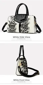 Detail view of snakeskin pattern leather handbag with contrast black and white panels
