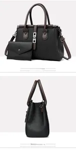 Detailed view of black lychee grain leather handbag set with mini envelope purse