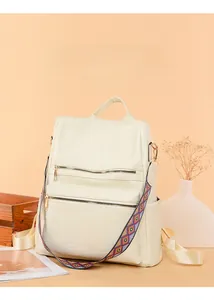 Detail of off-white leather backpack with multi-pocket design and ethnic shoulder strap