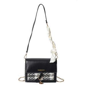 Fashionable black tweed flap crossbody bag with gold chain strap and decorative silk scarf