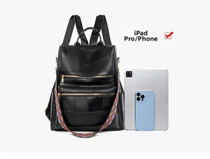 Detail view of black anti-theft backpack showing storage capacity for iPad and smartphone