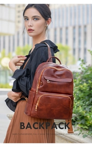 Outdoor street shot of women's vintage caramel brown soft leather backpack with gold hardware