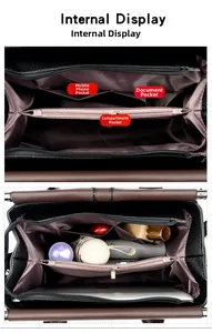 Internal view of a multi-compartment black leather tote bag with ample storage space