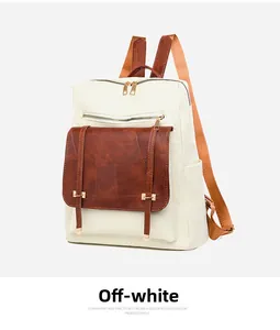 Detail view of cream-colored backpack featuring brown leather flap and geometric embossing