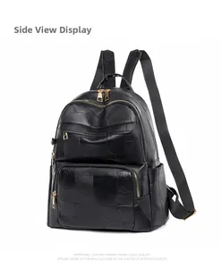 Side view of geometric patchwork black leather backpack with gold zippers and sturdy straps