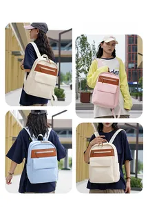 Detailed views of stylish Oxford fabric backpacks in white, pink, and sky blue colors