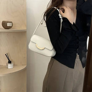 Minimalist white underarm shoulder bag with golden metal buckle and sleek leather texture