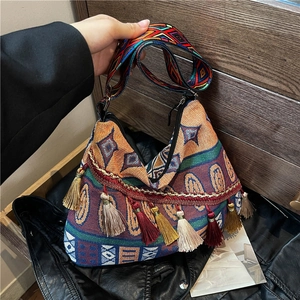 Ethnic bohemian tote bag with colorful tribal patterns and fringe tassels for women