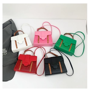 Detailed flat lay of chic embossed handbags in five colors with stylish textures
