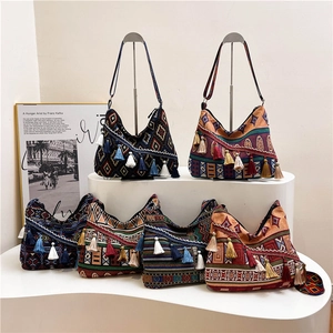 Set of six Bohemian style hobo shoulder bags with geometric patterns and tassels