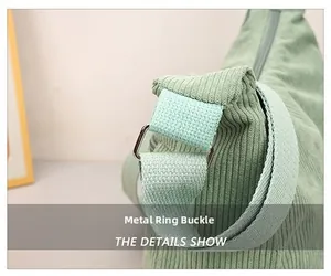 Close-up of the metal buckle and soft corduroy texture of the mint green crossbody bag