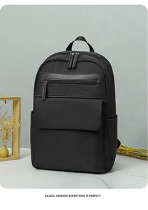 Close-up of black oxford business backpack featuring premium leather trim and side pockets
