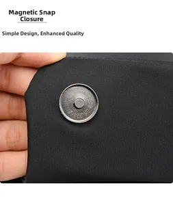 Detail of the vintage silver magnetic closure on a black Oxford fabric backpack