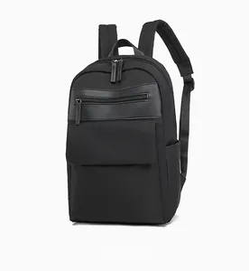 Side view of black oxford fabric backpack with leather accents and adjustable straps