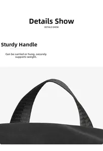 Macro shot of reinforced top handle on a black backpack showing heavy-duty nylon texture
