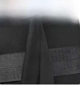 Detail of wide black fabric shoulder strap showing high-density woven texture and stitching