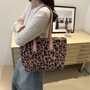 Pink leopard print faux fur tote bag for women shown as a stylish winter shoulder bag
