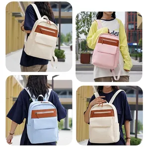 Chic waterproof oxford backpack in beige pink and blue tones for stylish commuting