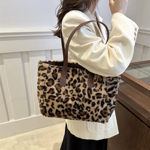 Plush leopard print tote bag for women with faux fur texture and brown leather straps