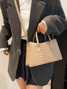 Elegant beige PU leather handbag with crocodile pattern and golden hardware strap