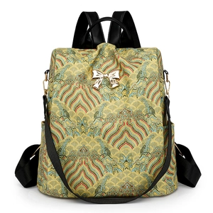 Women's yellow jacquard backpack with traditional sea pattern and golden bow