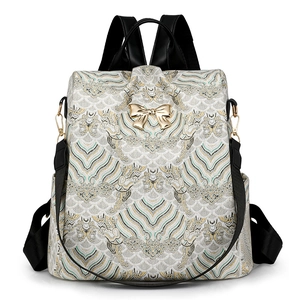 Vintage jacquard wave pattern backpack with gold bow buckle for women stylish look