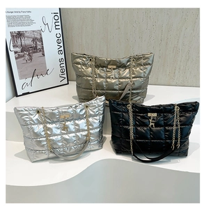 Quilted tote bags in gold, silver, and black with metallic finish and chain straps