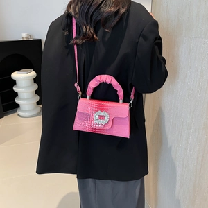 Pink croc-embossed handbag with rhinestone buckle and ruffled top handle for women