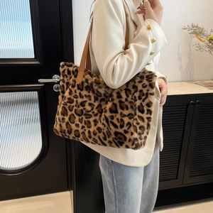 Stylish oversized leopard print faux fur tote bag with brown leather straps for women
