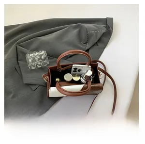 Internal view of crocodile pattern tote bag showing space for phone and cosmetics