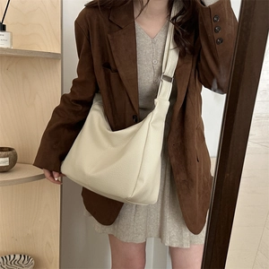 Minimalist creamy white large crossbody tote bag with pebble texture and wide strap