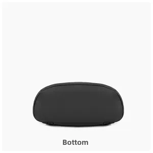 Detail view of the durable wear-resistant bottom base of the black travel backpack