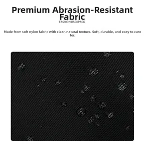 Close-up of black waterproof nylon fabric with clear water droplets on the surface