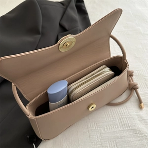Minimalist nude faux leather shoulder bag with floral buckle and gold chain strap