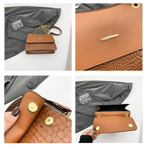 Close-up of brown crocodile texture leather bag with gold chain and dual magnetic buckles