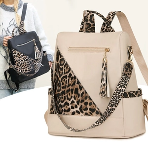 Fashionable leopard print backpack in black and beige with tassels and waterproof fabric