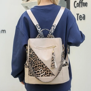 Beige leopard print nylon backpack and shoulder bag with gold zippers and tassels