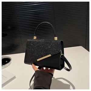 Elegant black sequin underarm bag with gold metallic trim and crossbody strap detail